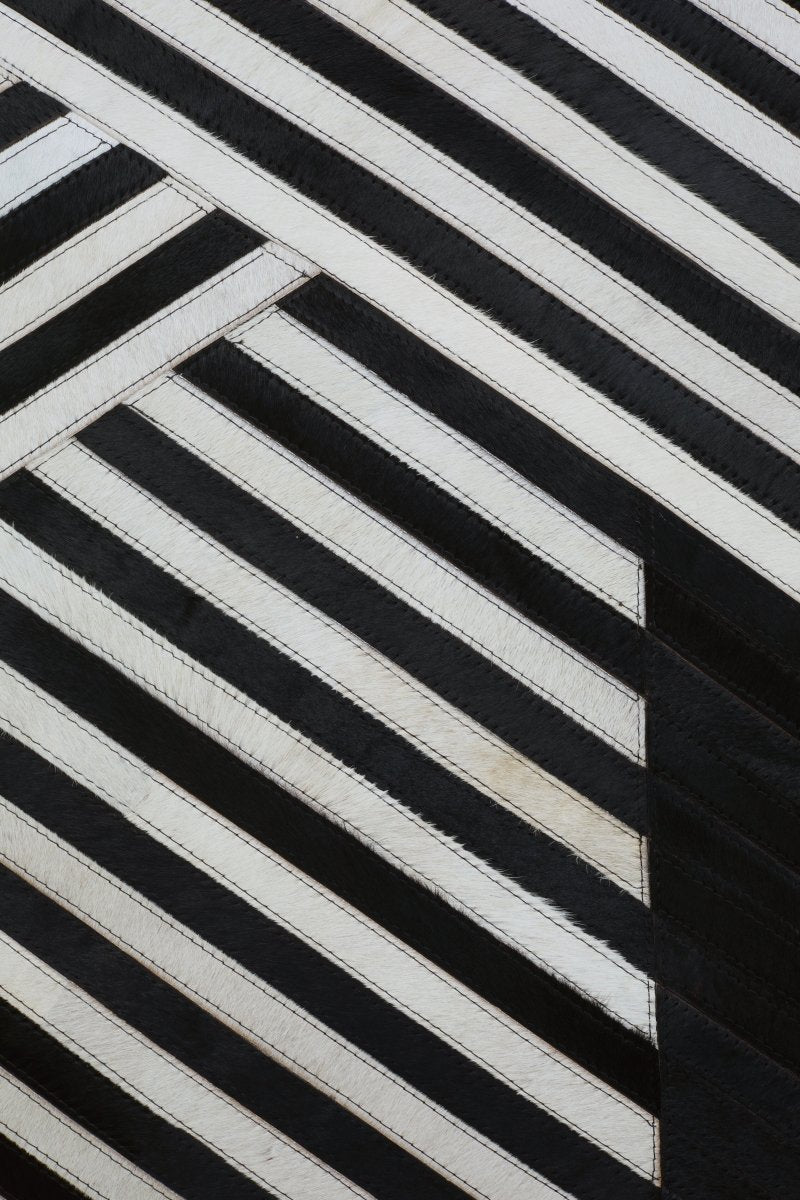 Matto Safira Large Black And White Hair On Leather Rug - OPULENT Co